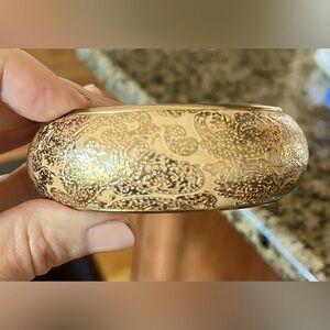 Wide bangle bracelet, gold tone with ornate design